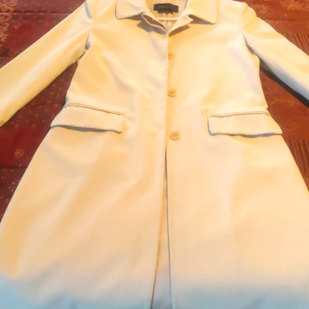 BCBG Maxazria long sleeved classic trench coat.